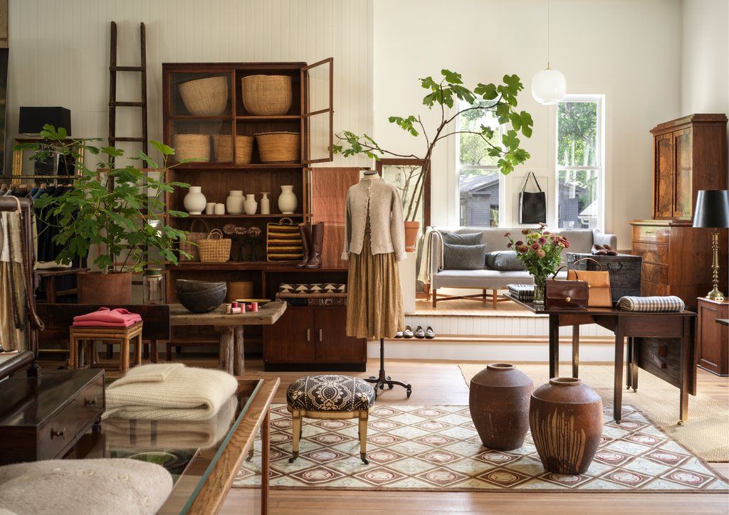 A sunlit modern interior styled with handcrafted Indian ceramics, brass and linen